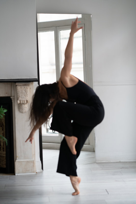 Student performing contemporary dance in studio
